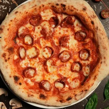 Beef pepperoni pizza, cupped and crisped at the edges.