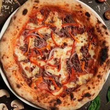 Carnivora pizza loaded with beef salami, sausage and speck.