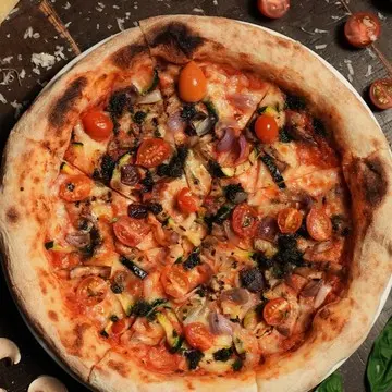 Ortolana pizza covered in grilled vegetables.
