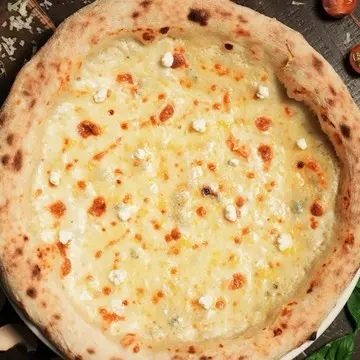 Quattro Formaggi pizza, pale and molten with four cheeses.