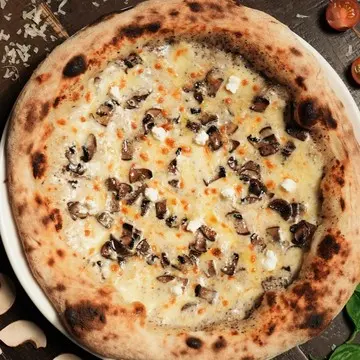 Tartufo pizza with sautéed portobello and truffle salsa.